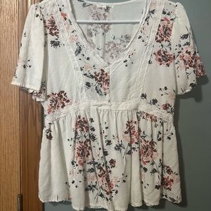 maurice’s top, flower design, variety of colors, lace around the shirt